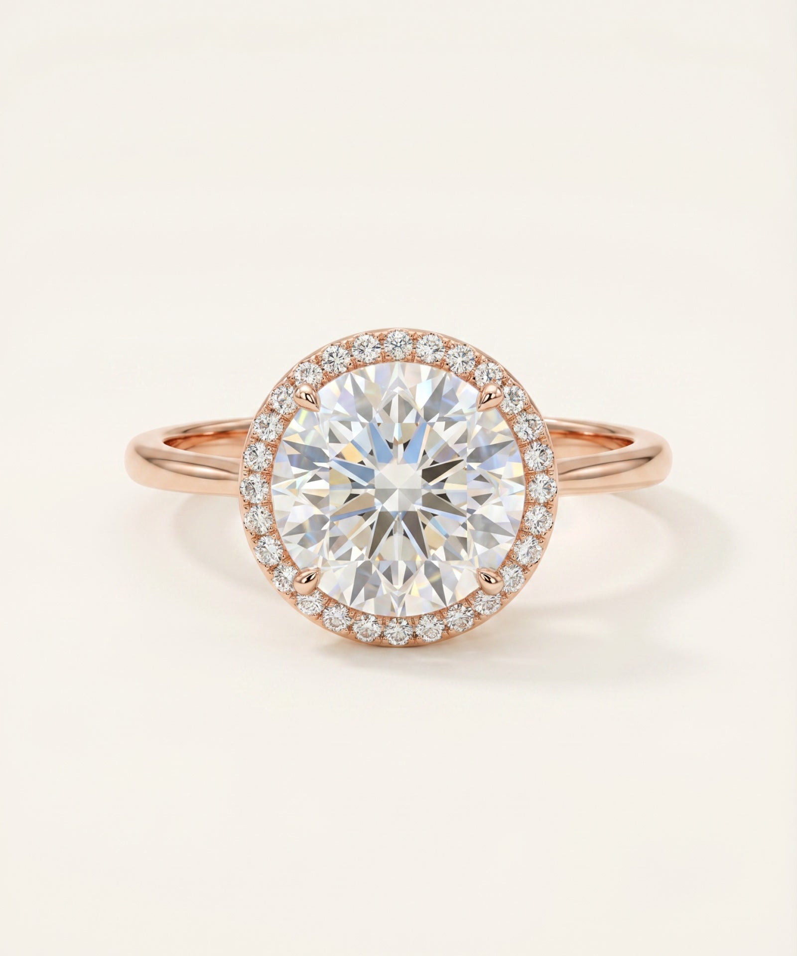 Grand Halo Ring in 18k Rose Gold showing the high-impact brilliance of the 3-carat moissanite and shimmering pavé accents.
