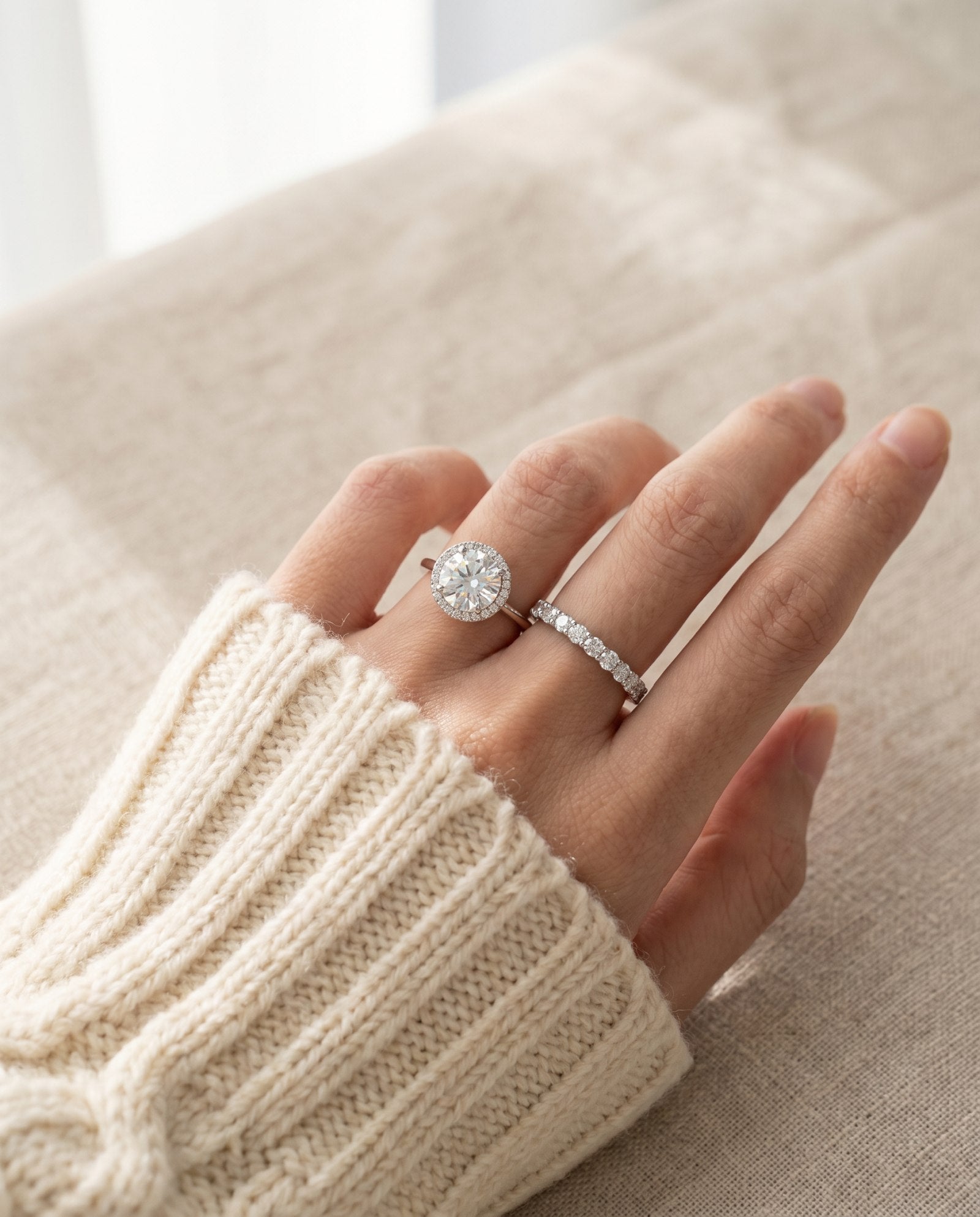 Lifestyle model shot of Grand Halo Ring in Silver, showing how the large 3-carat solitaire commands attention in natural light.