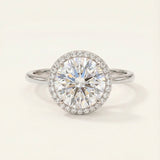 Grand Halo Ring in Rhodium-plated Sterling Silver with a massive 3ct moissanite center and timeless halo design.
