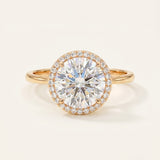 Grand Halo Ring in 18k Yellow Gold featuring a 3ct (9mm) brilliant-cut moissanite center and 11mm pavé halo setting.