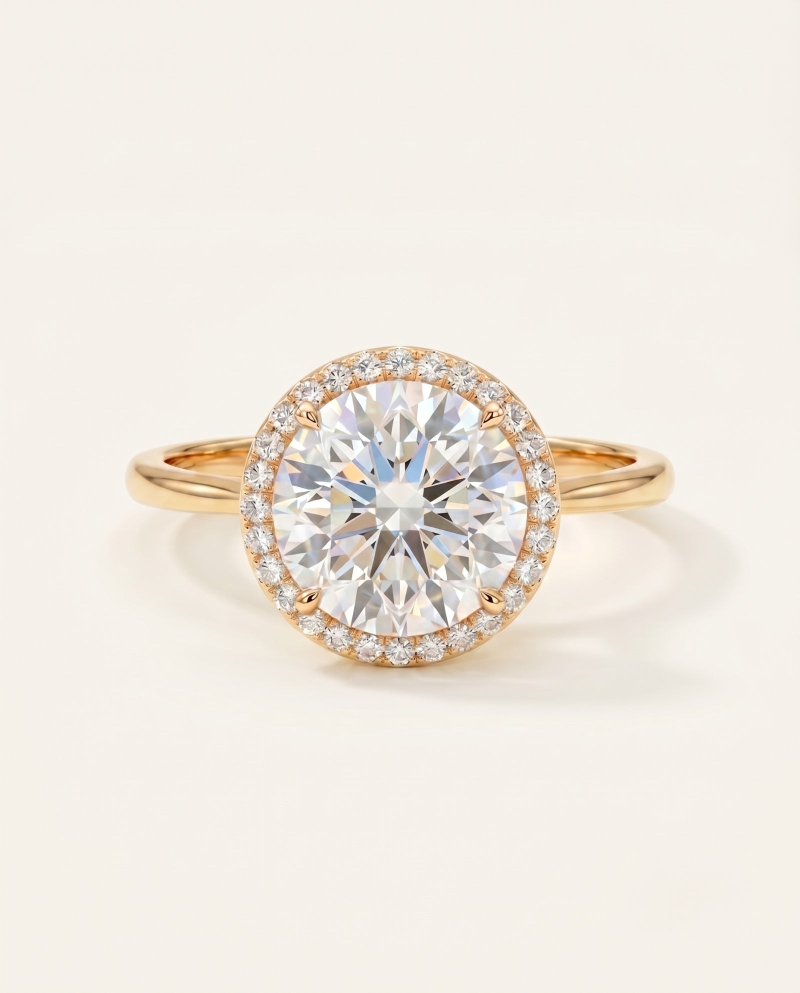 Grand Halo Ring in 18k Yellow Gold featuring a 3ct (9mm) brilliant-cut moissanite center and 11mm pavé halo setting.