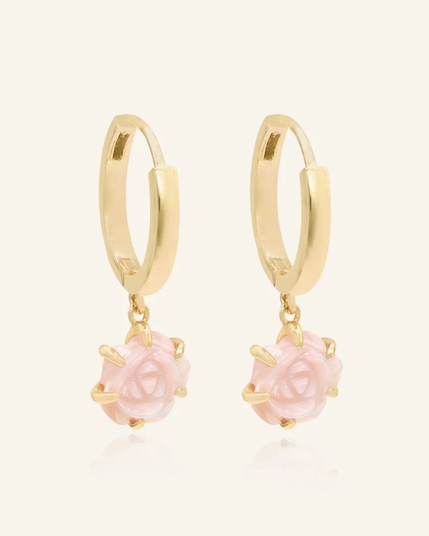 Elegant hand-carved pink shell rose huggies in yellow gold, featuring delicate floral craftsmanship for a timeless and romantic look.