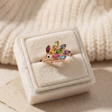 Hedgehog Ring (Multi-Gemstones) in rose gold, laid flat on a tabletop