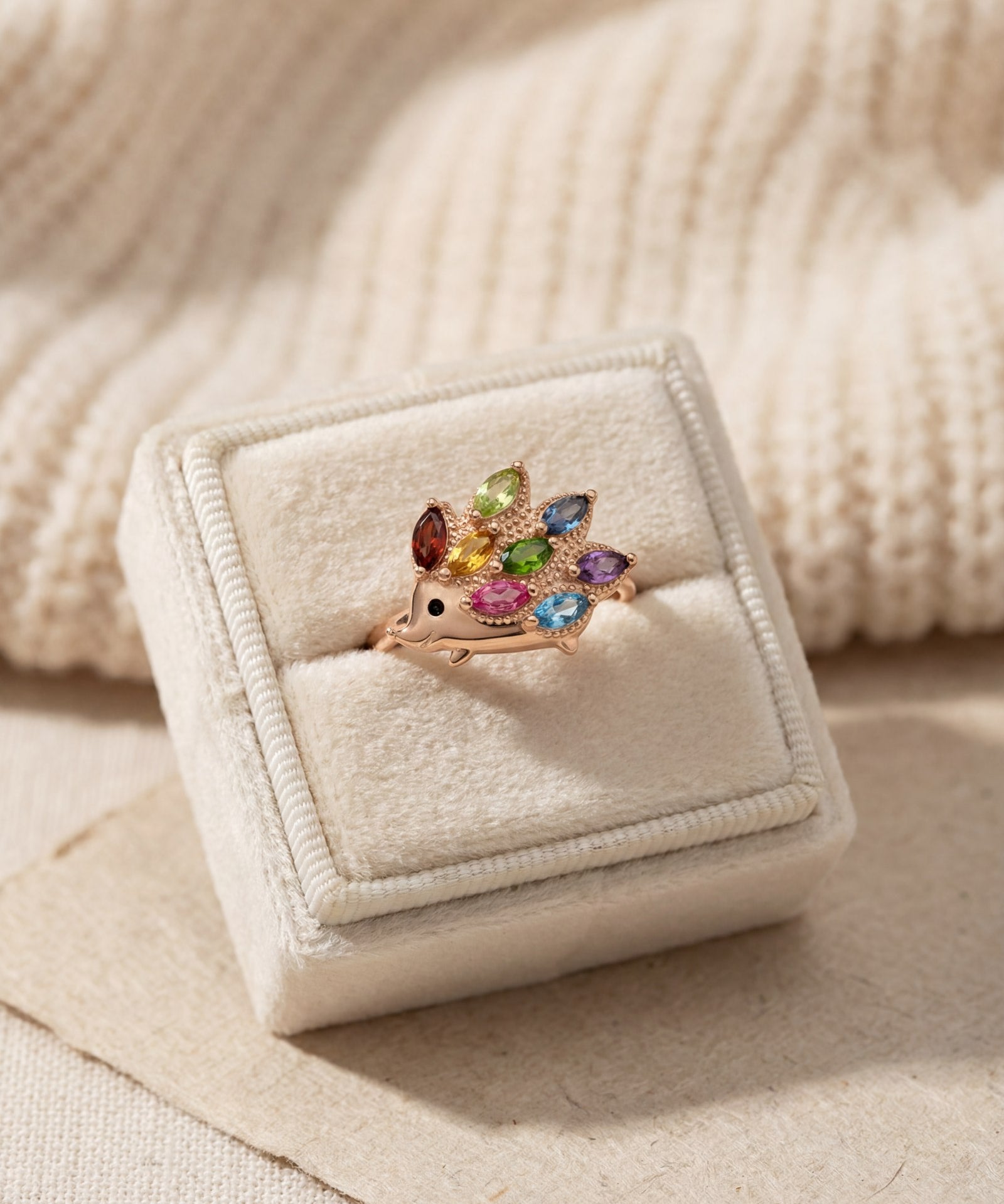 Hedgehog Ring (Multi-Gemstones) in rose gold, laid flat on a tabletop