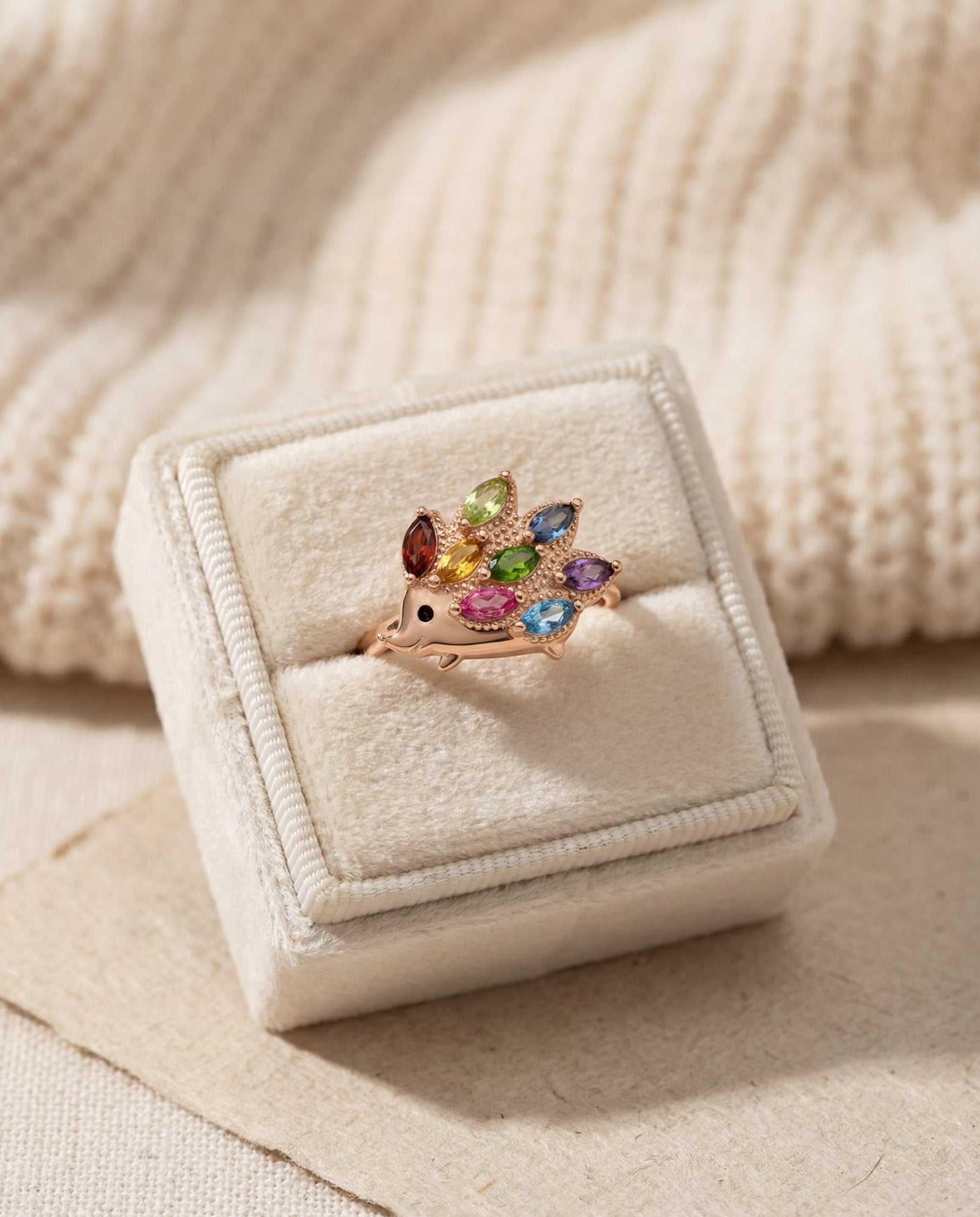 Hedgehog Ring (Multi-Gemstones) in rose gold, laid flat on a tabletop