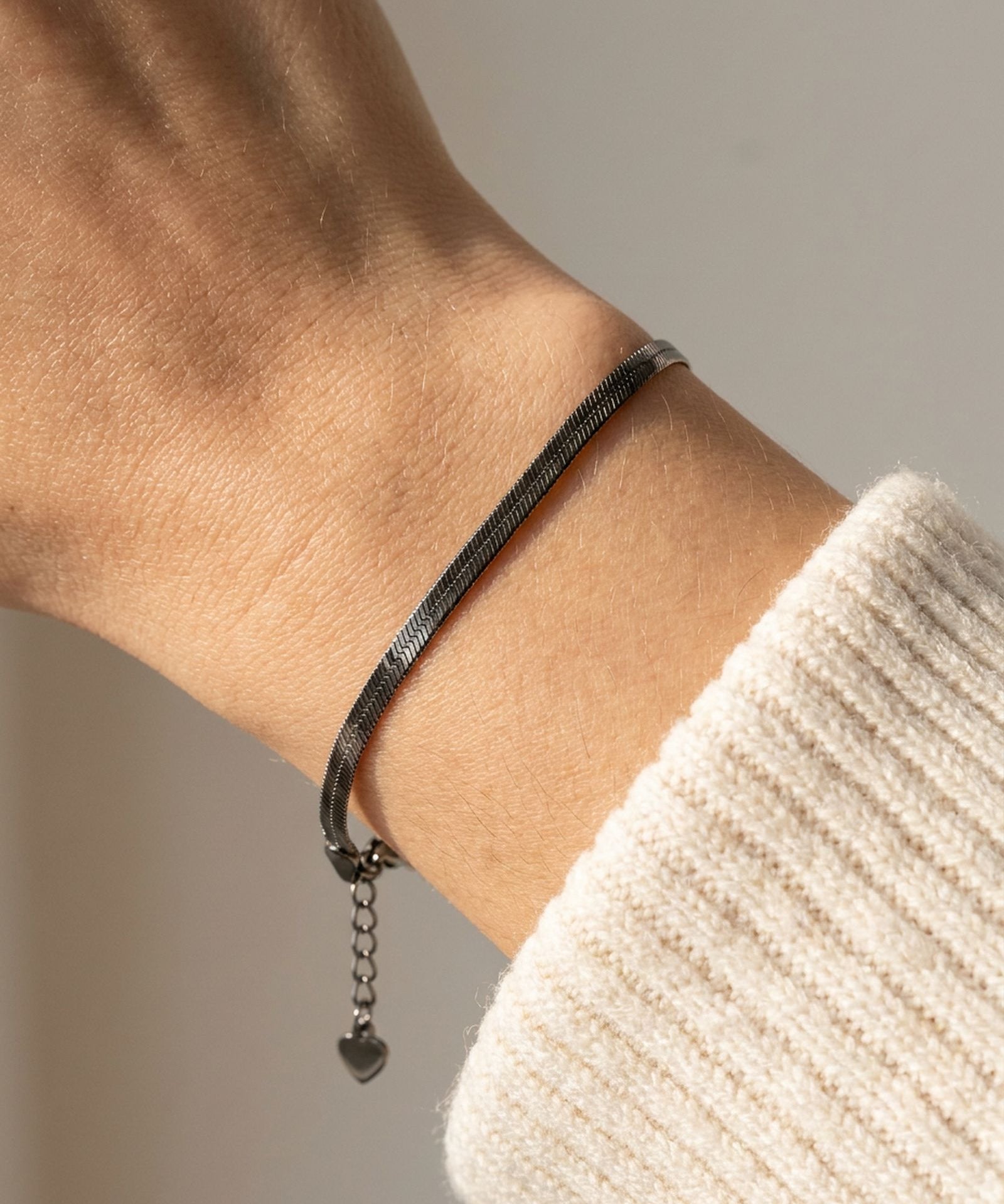 Herringbone Bracelet | Elate in black gold, worn on a model