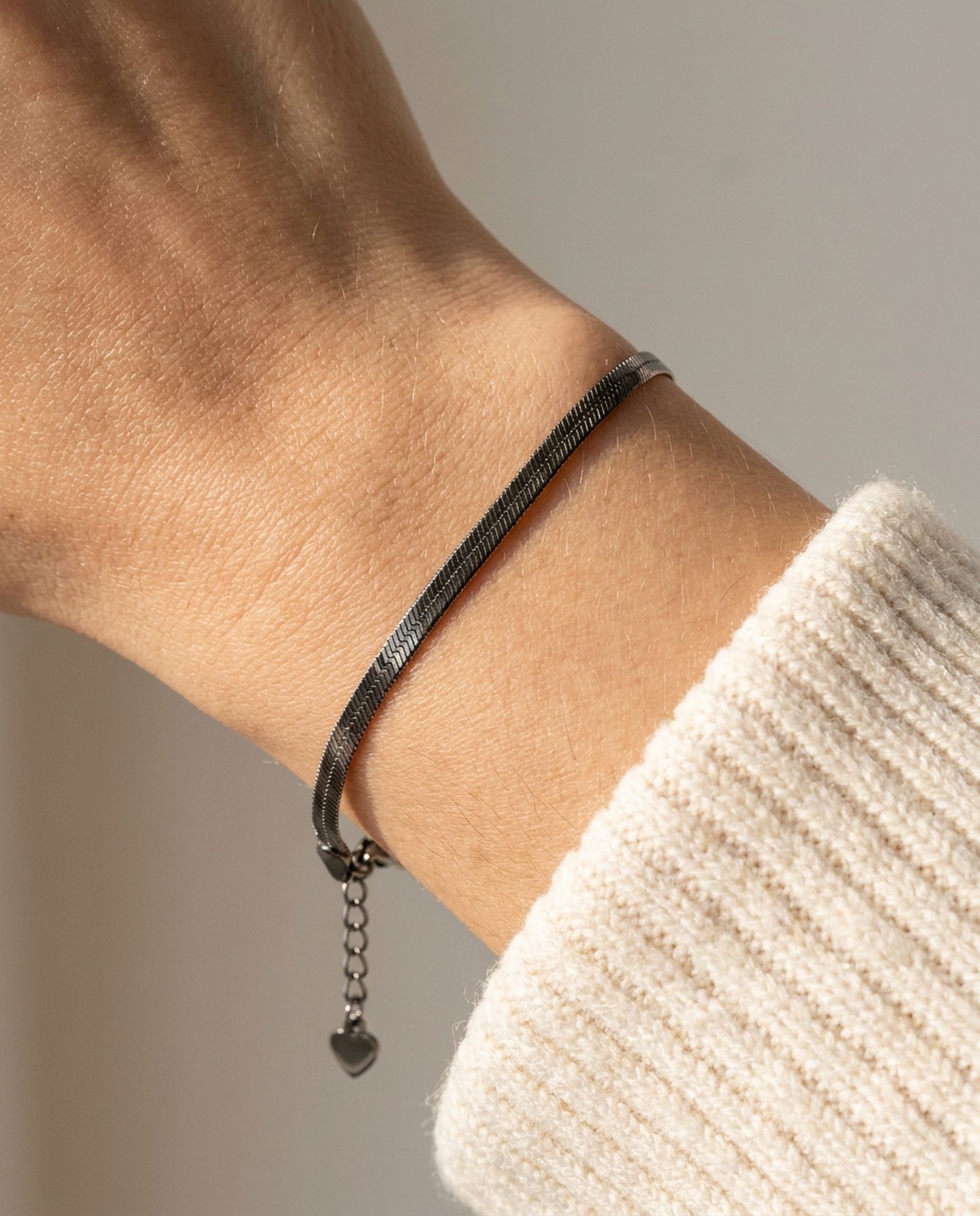 Herringbone Bracelet | Elate in black gold, worn on a model