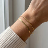 Herringbone Bracelet | Elate in yellow gold, worn on a model