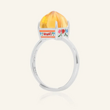 Silver Huat Kueh-inspired ring featuring a vibrant citrine gemstone as the steamed cake centerpiece, adorned with intricate enamel details, including 'Huat' and floral accents symbolizing prosperity and joy.