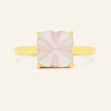 Huat Kueh Ring (Rose Quartz) in rose gold, resting on a warm linen background, alternate angle