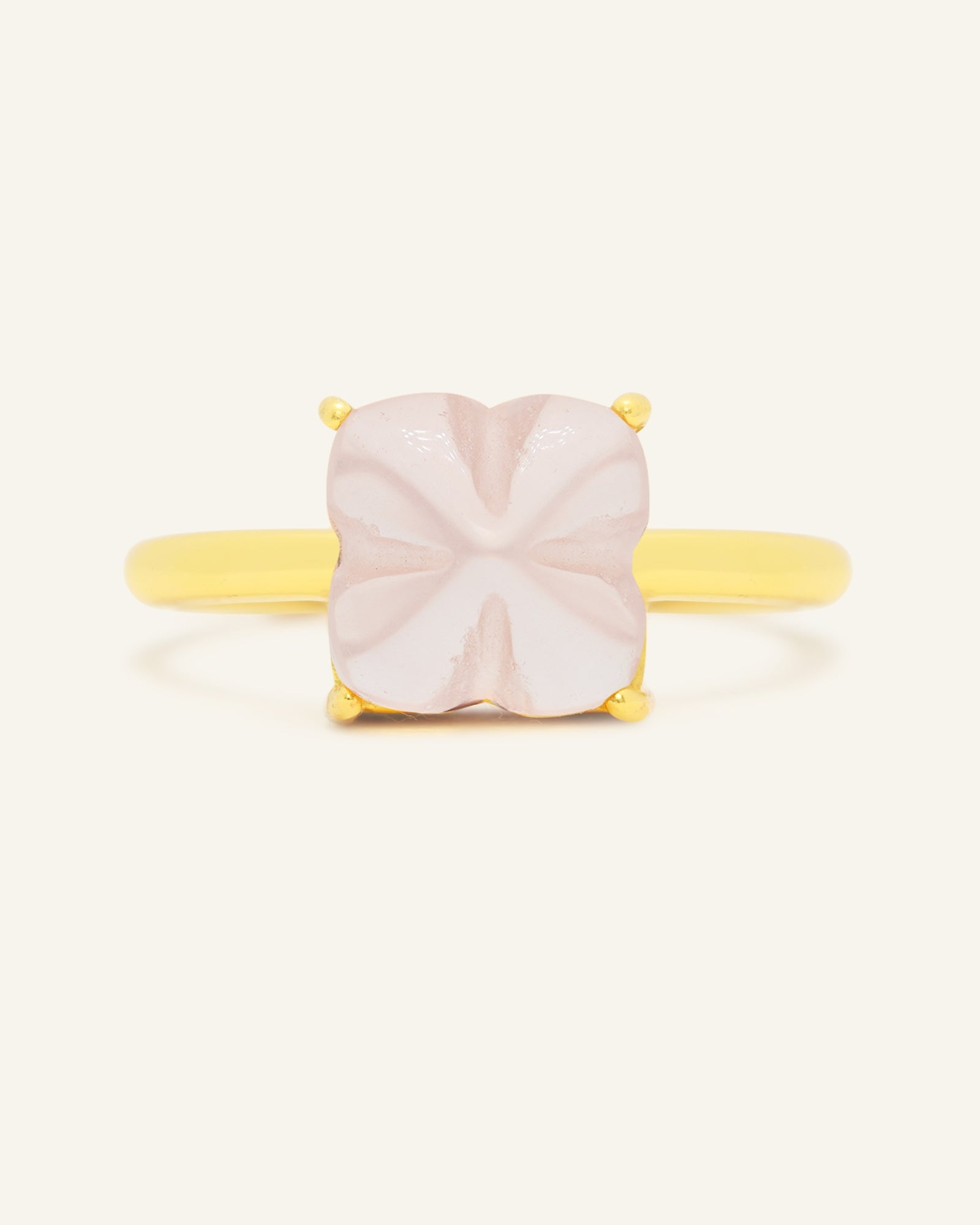 Huat Kueh Ring (Rose Quartz) in rose gold, resting on a warm linen background, alternate angle