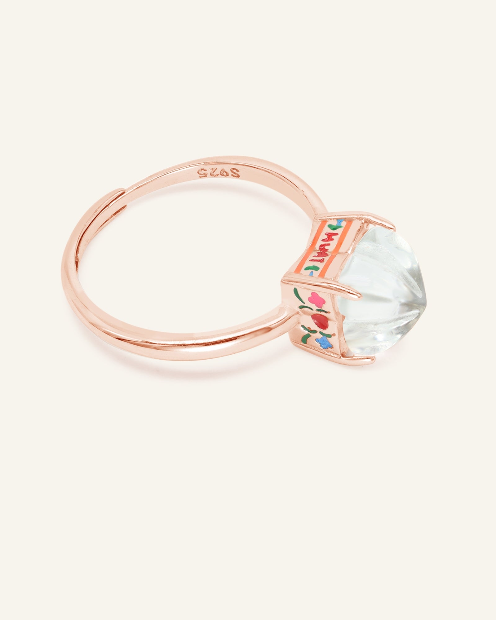 Huat Kueh Ring (White Topaz) in rose gold, resting on a warm linen background, alternate angle