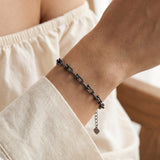 Lock Link Bracelet | Elate in black gold, worn on a model