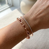 Lock Link Bracelet | Elate in rose gold, worn on a model, stacked