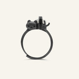 Maki Meow Sushi Ring | White Jade in black gold, resting on a warm linen background