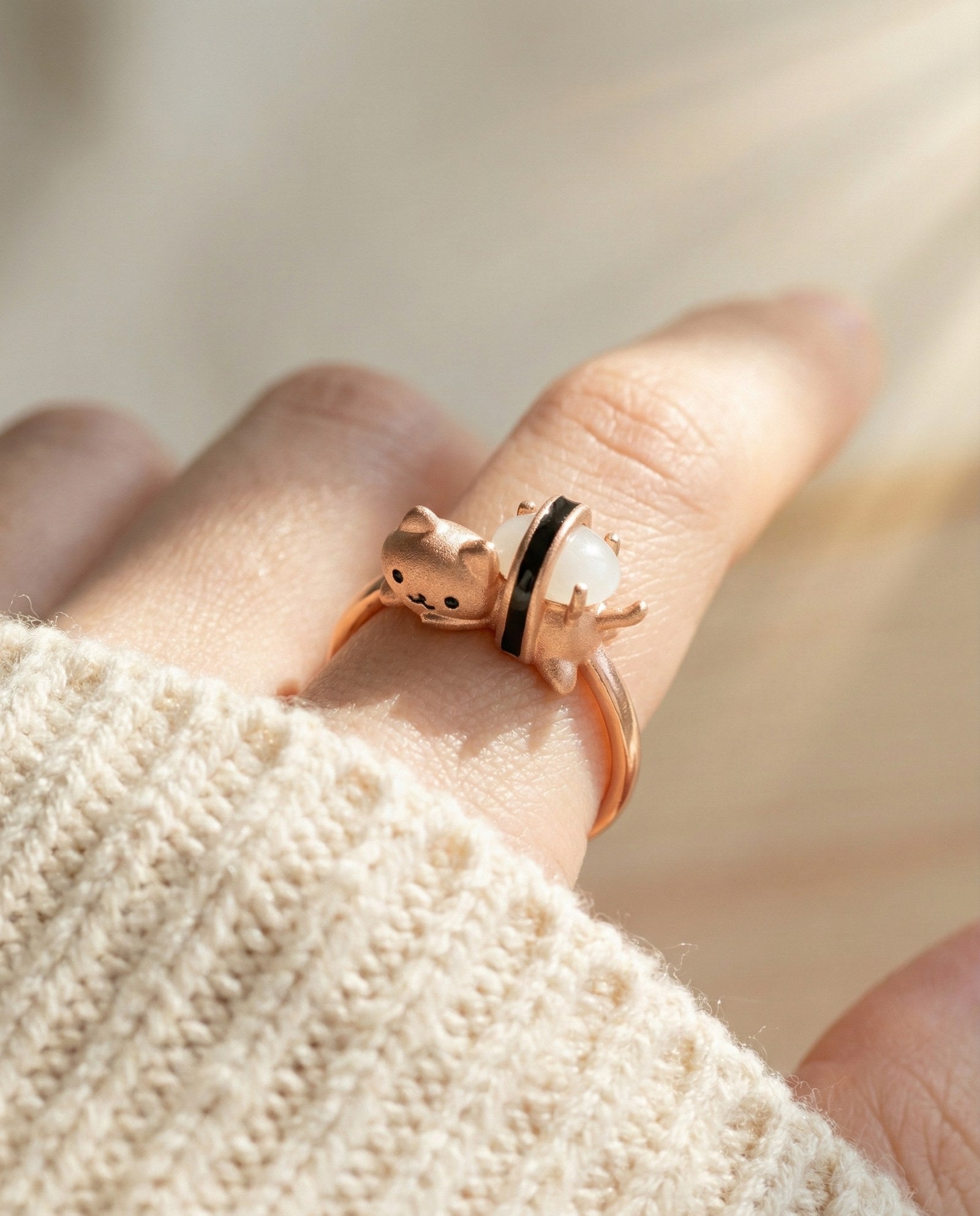 Maki Meow Sushi Ring | White Jade in rose gold, worn on a model