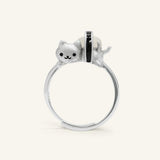 Maki Meow Sushi Ring | White Jade in silver, resting on a warm linen background