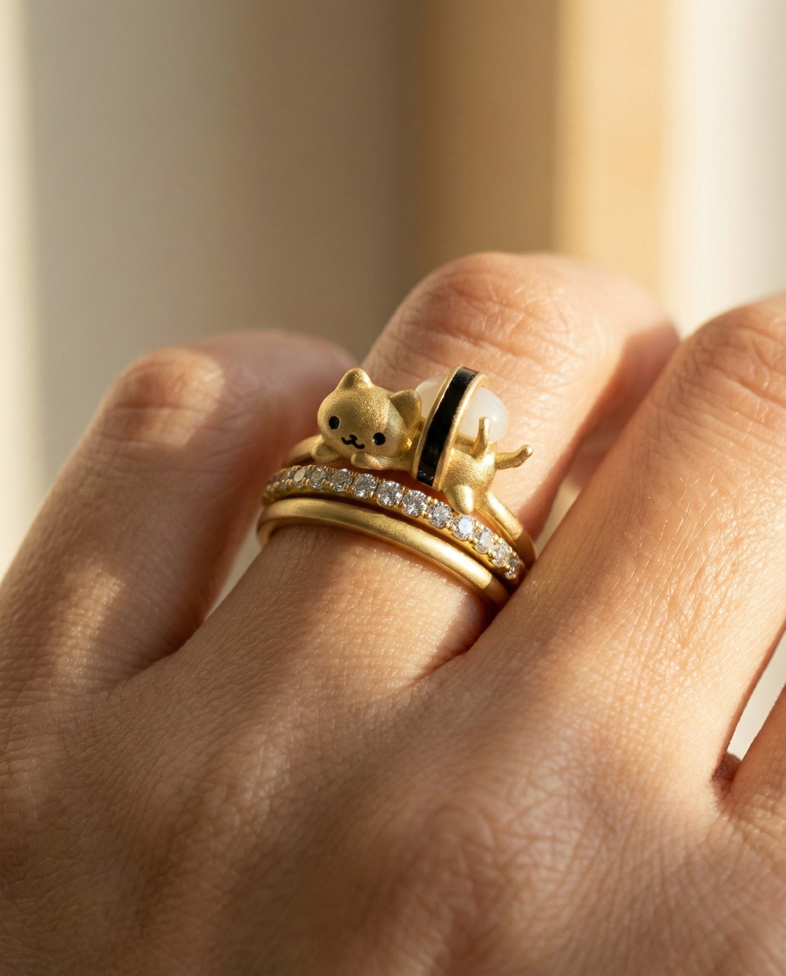 Maki Meow Sushi Ring | White Jade in yellow gold, worn on a model, stacked