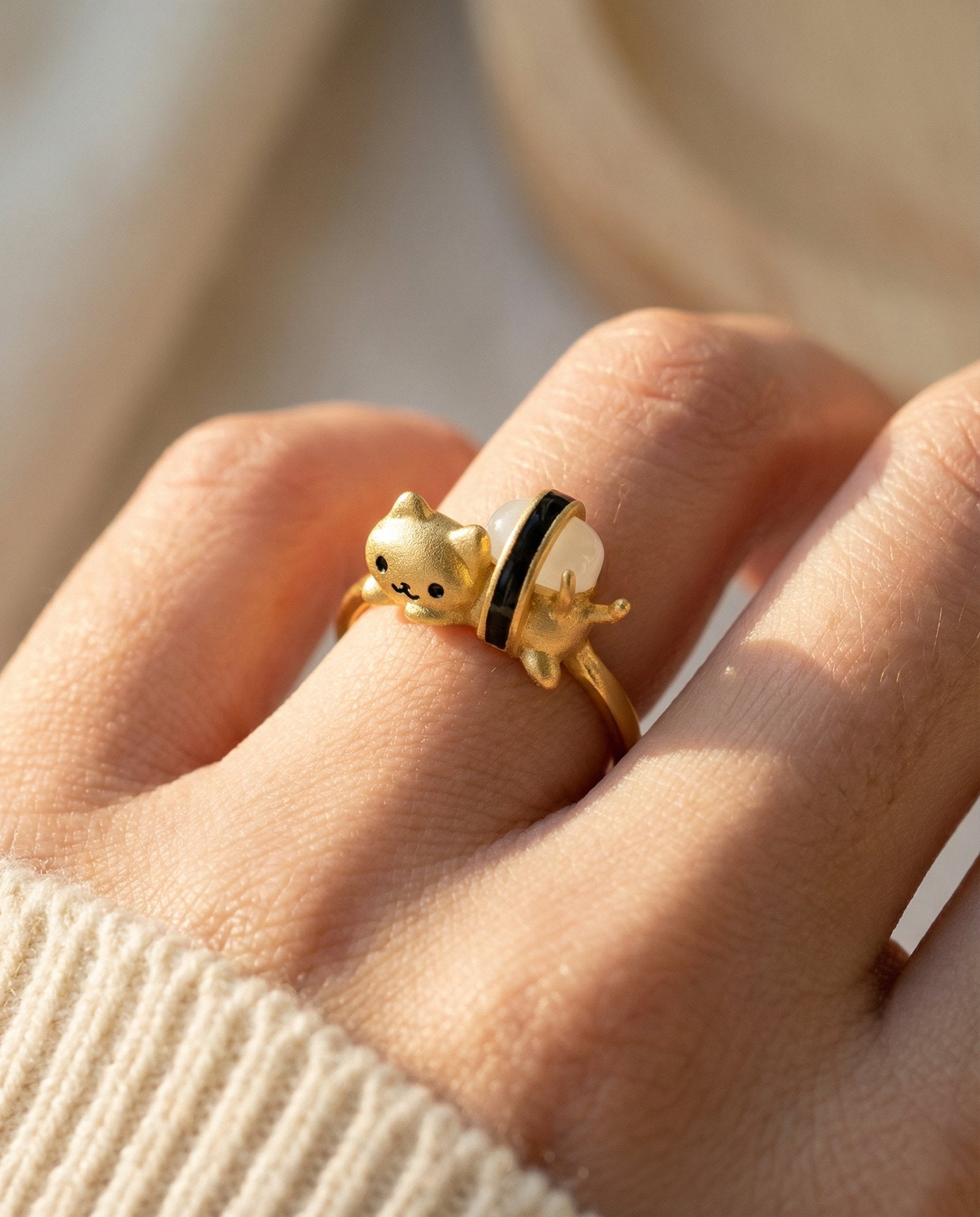 Maki Meow Sushi Ring | White Jade in yellow gold, worn on a model