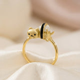 Maki Meow Sushi Ring | White Jade in yellow gold, laid flat on a tabletop