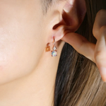 natural opal earring hooks in rose gold on model
