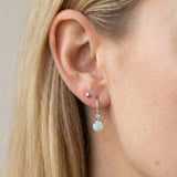 Atlas Opal Ear Drops in silver, worn on a model