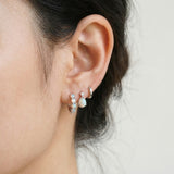 Lumi Opal Hoops in silver, worn on a model, alternate angle