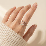Opal Serpentine Ring with pear-cut natural opal and baguette stones in 18k Rose Gold over 925 Silver worn on hand
