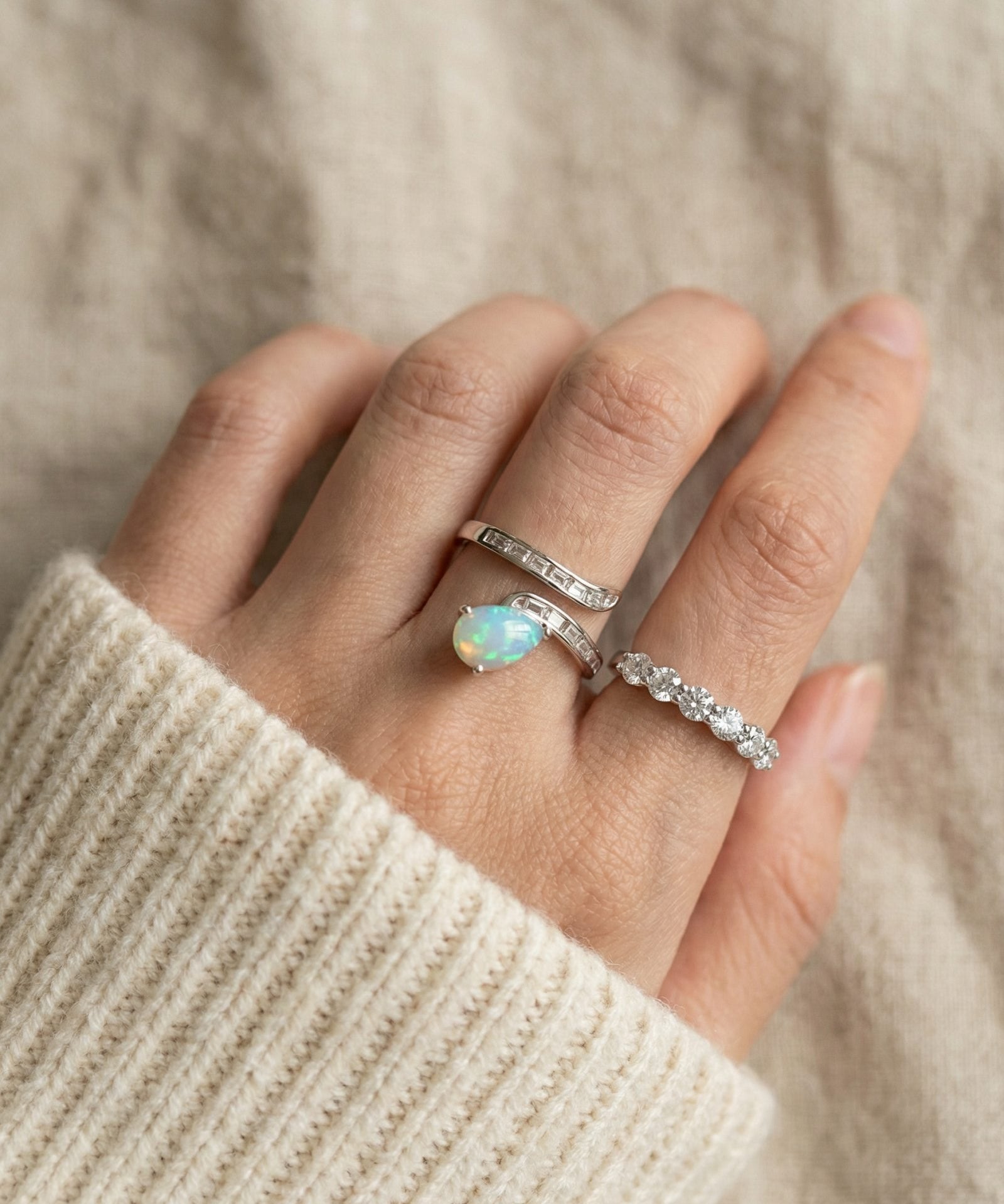 Pear cut natural opal ring paired with eternity moissanite band