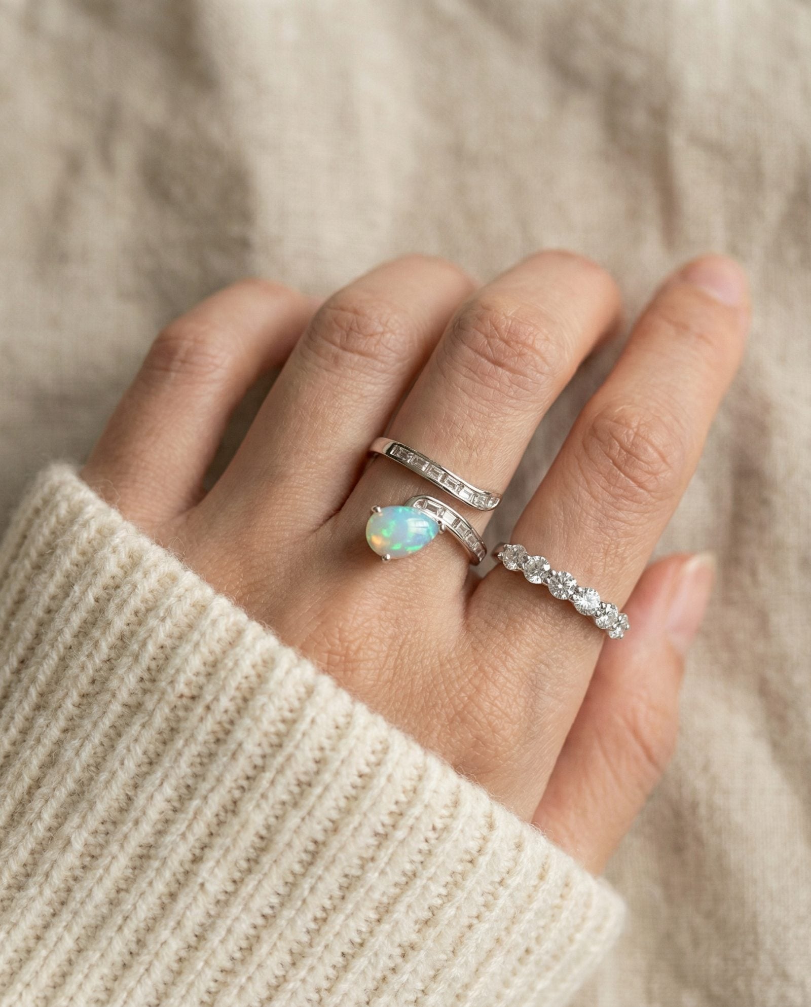 Pear cut natural opal ring paired with eternity moissanite band