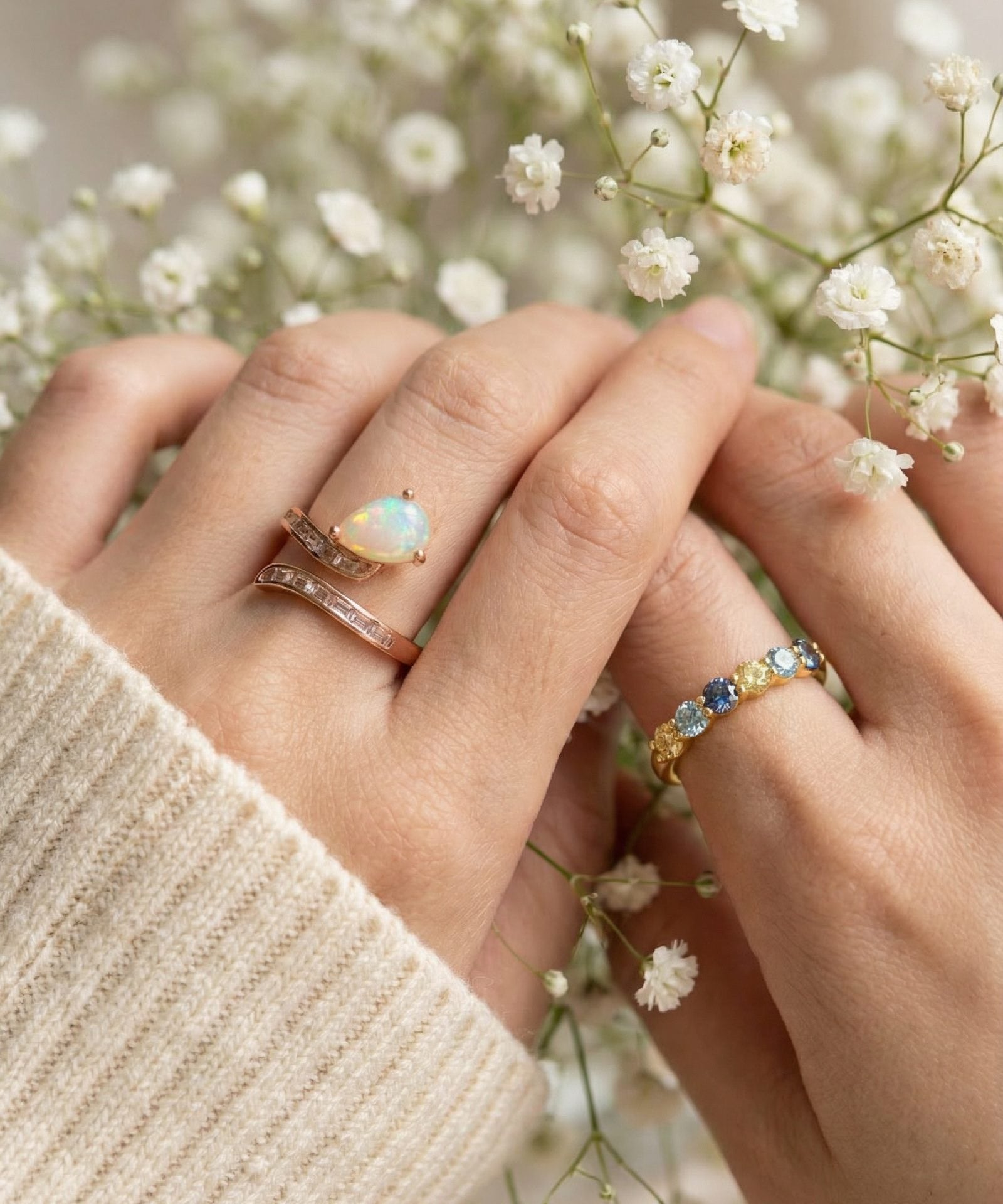 Teardrop Ethiopian opal ring and baguette stones in Rose Gold worn on model