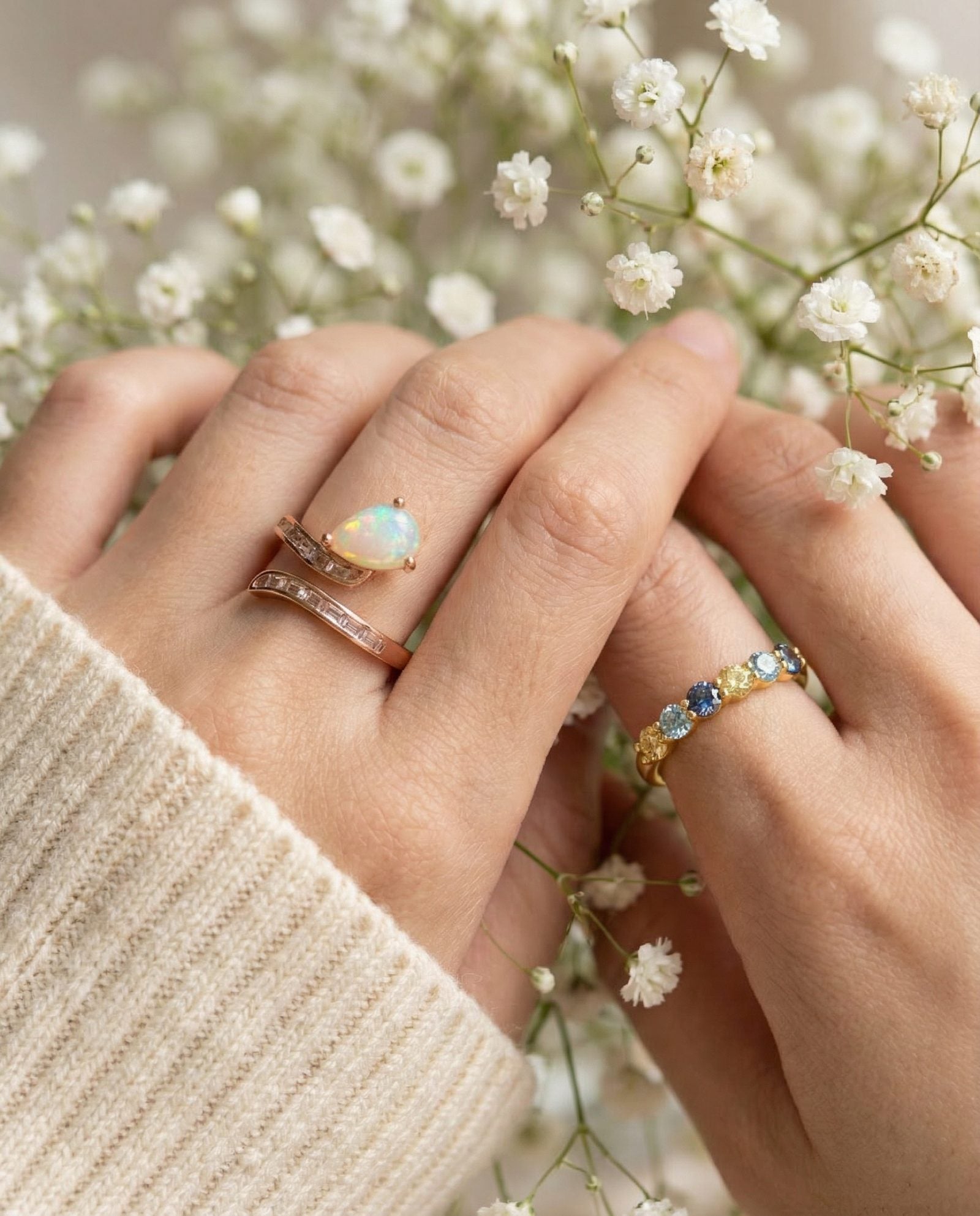Teardrop Ethiopian opal ring and baguette stones in Rose Gold worn on model
