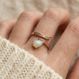 macro upclosed image of teardrop ethiopian opal ring in rose gold