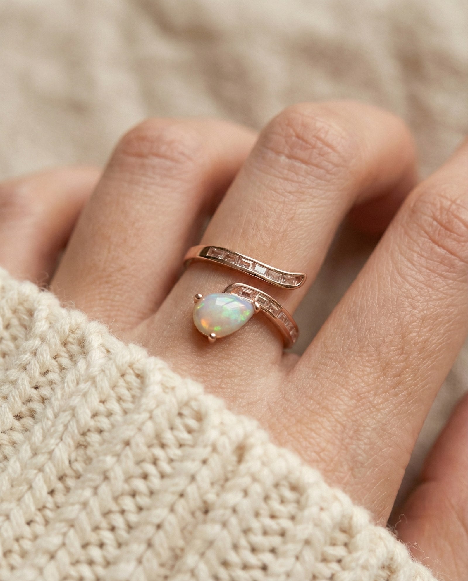macro upclosed image of teardrop ethiopian opal ring in rose gold