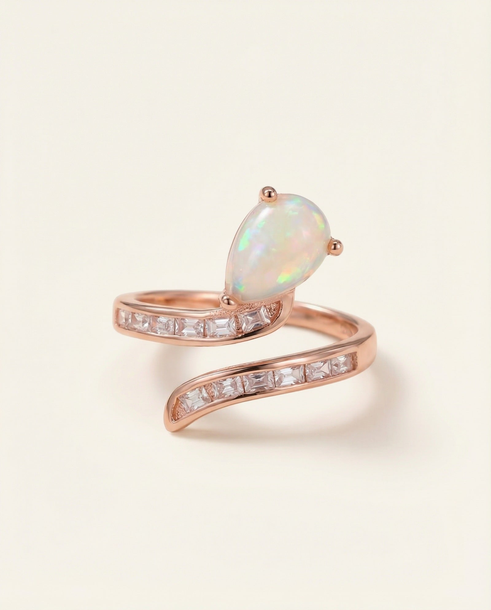 Opal Serpentine Ring with pear-cut natural opal and baguette stones in 18k Rose Gold over 925 Silver