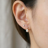 Suri Opal Teardrop Studs in rose gold, worn on a model