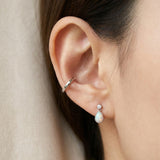 Suri Opal Teardrop Studs in silver, worn on a model
