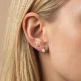 Suri Opal Teardrop Studs in yellow gold, worn on a model