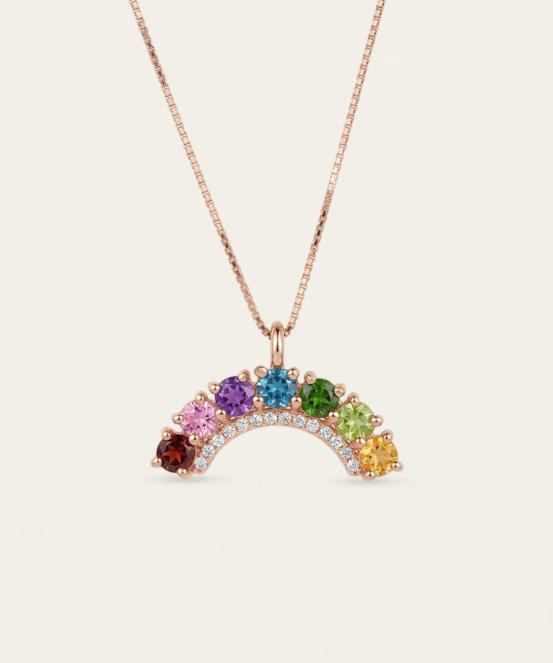 18k rose gold vermeil over the rainbow arc necklace displaying seven vibrant round-cut natural gemstones with a crystal border.