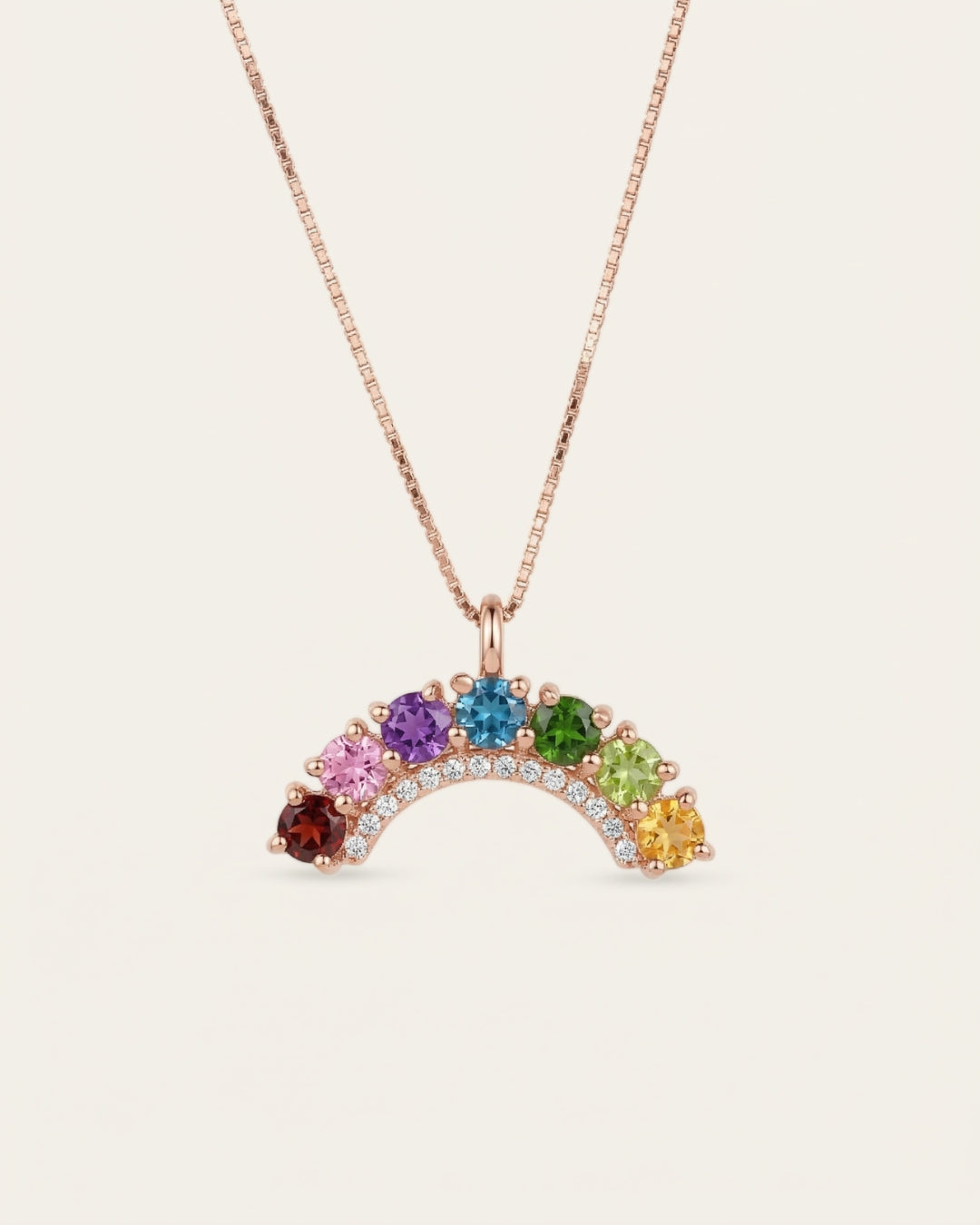 18k rose gold vermeil over the rainbow arc necklace displaying seven vibrant round-cut natural gemstones with a crystal border.