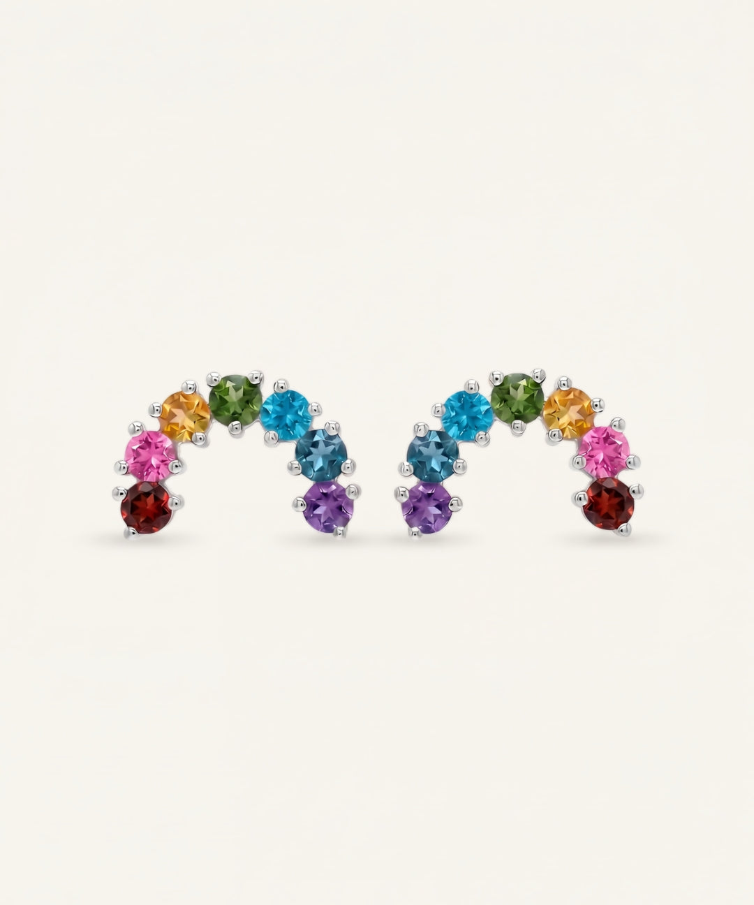 Pair of 925 sterling silver curved rainbow arc climber earrings with natural garnet, topaz, diopside, and amethyst.