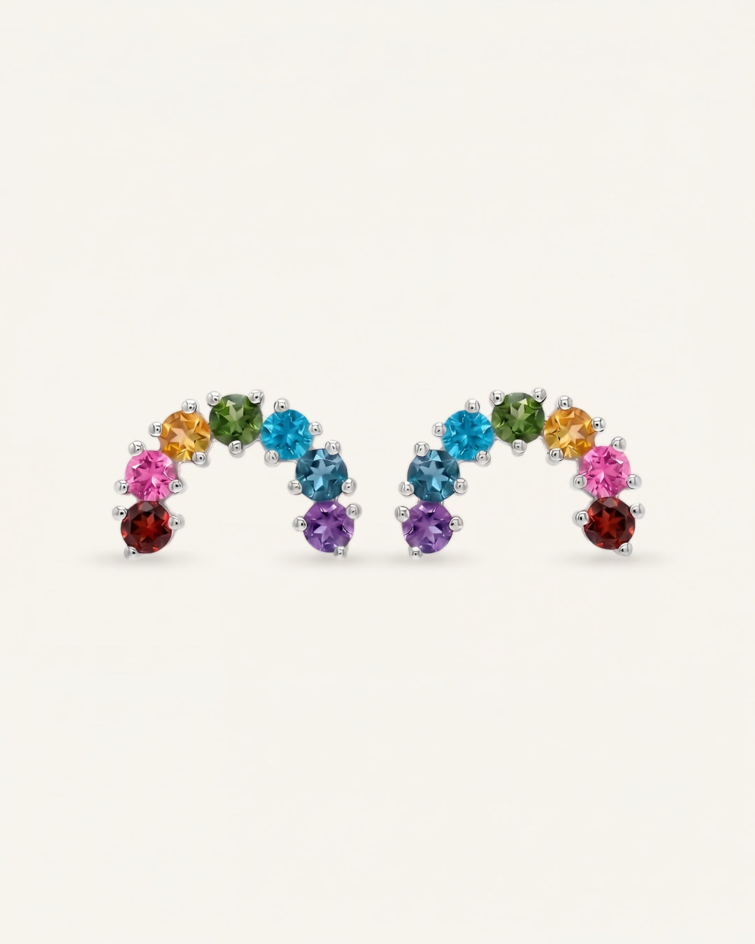 Pair of 925 sterling silver curved rainbow arc climber earrings with natural garnet, topaz, diopside, and amethyst.