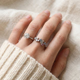 Lifestyle shot of the Painter’s Palette Ring in Silver stacked with a brilliant-cut solitaire to demonstrate a high-end, artistic ring stack.