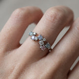 Scale view of the Painter’s Palette moissanite ring in silver worn on a finger to show the organic, hand-painted silhouette.