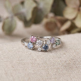 Extreme macro detail of the Painter’s Palette Ring, showing the different pastel tones and high-brilliance fire of the moissanite stones.