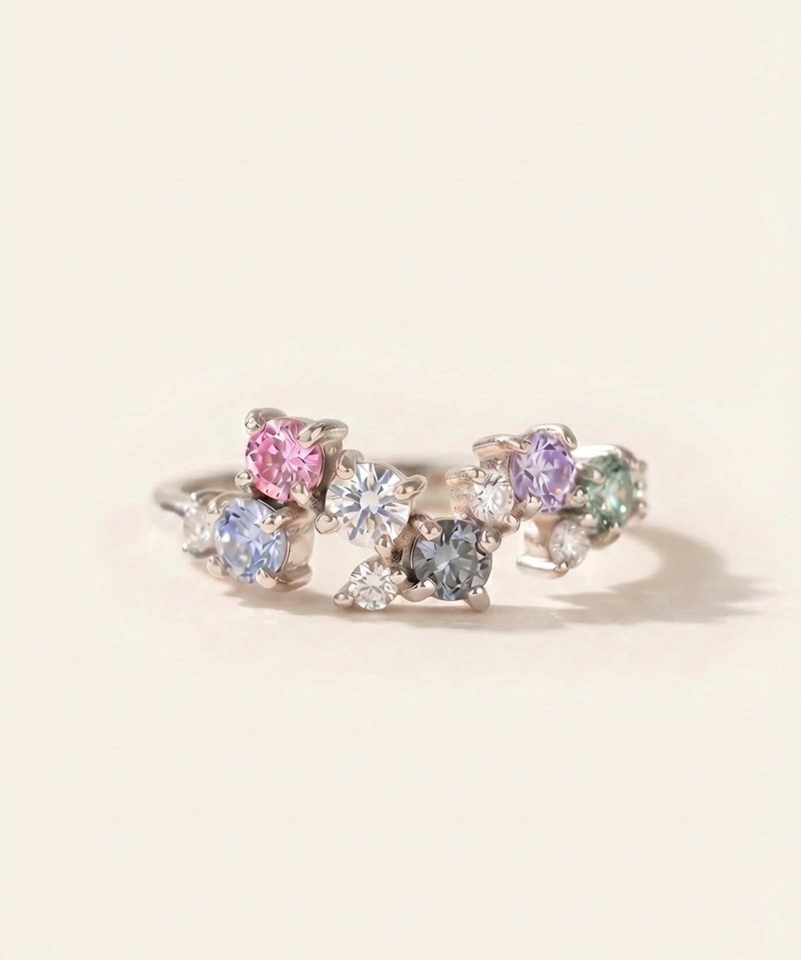 Painter’s Palette Ring in Rhodium-plated Silver showing the ethereal, rainbow sparkle of the multi-stone moissanite cluster.