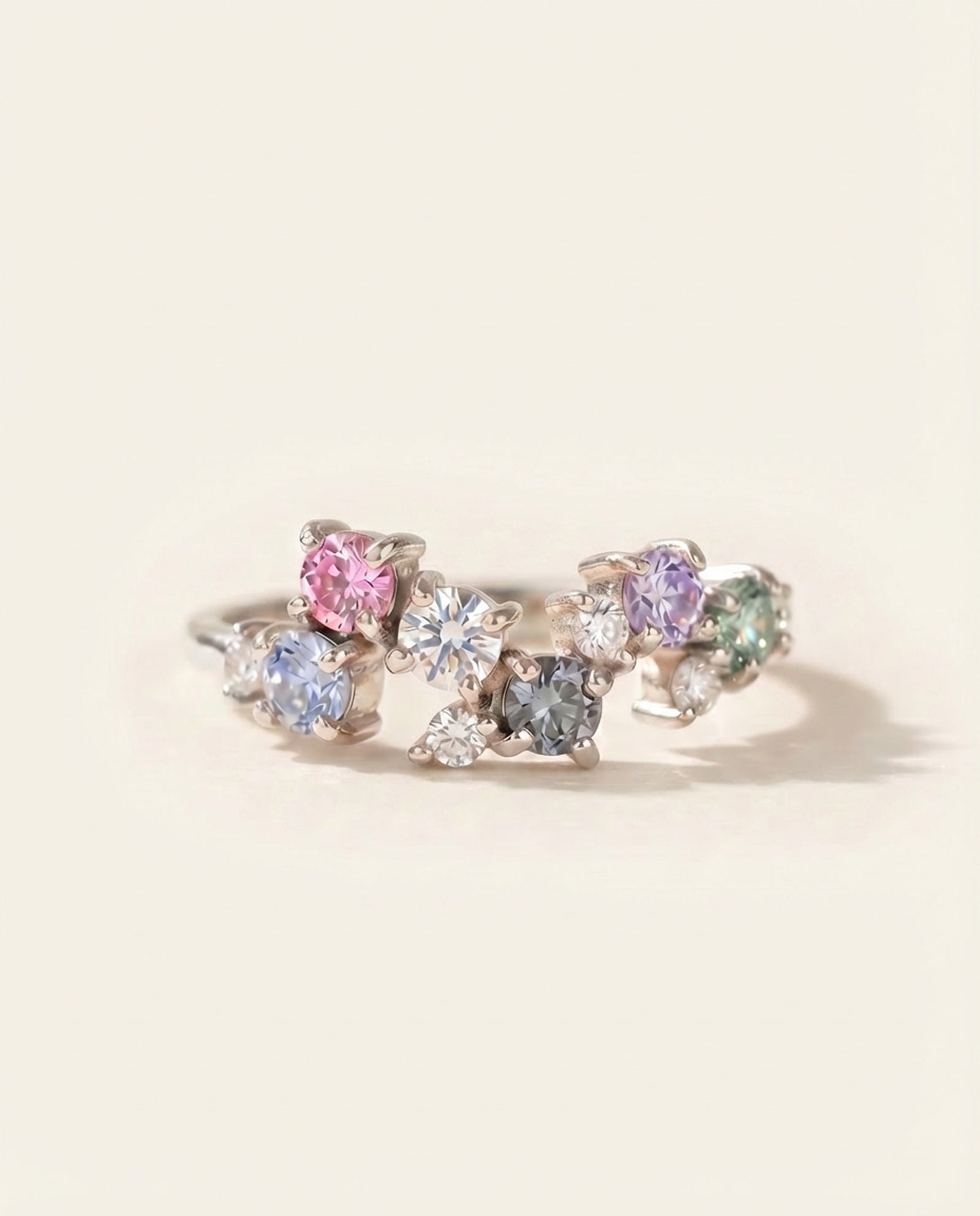 Painter’s Palette Ring in Rhodium-plated Silver showing the ethereal, rainbow sparkle of the multi-stone moissanite cluster.