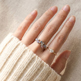 On-hand view of the Painter’s Palette Ring in Yellow Gold, showcasing the soft pastel colors against natural light.