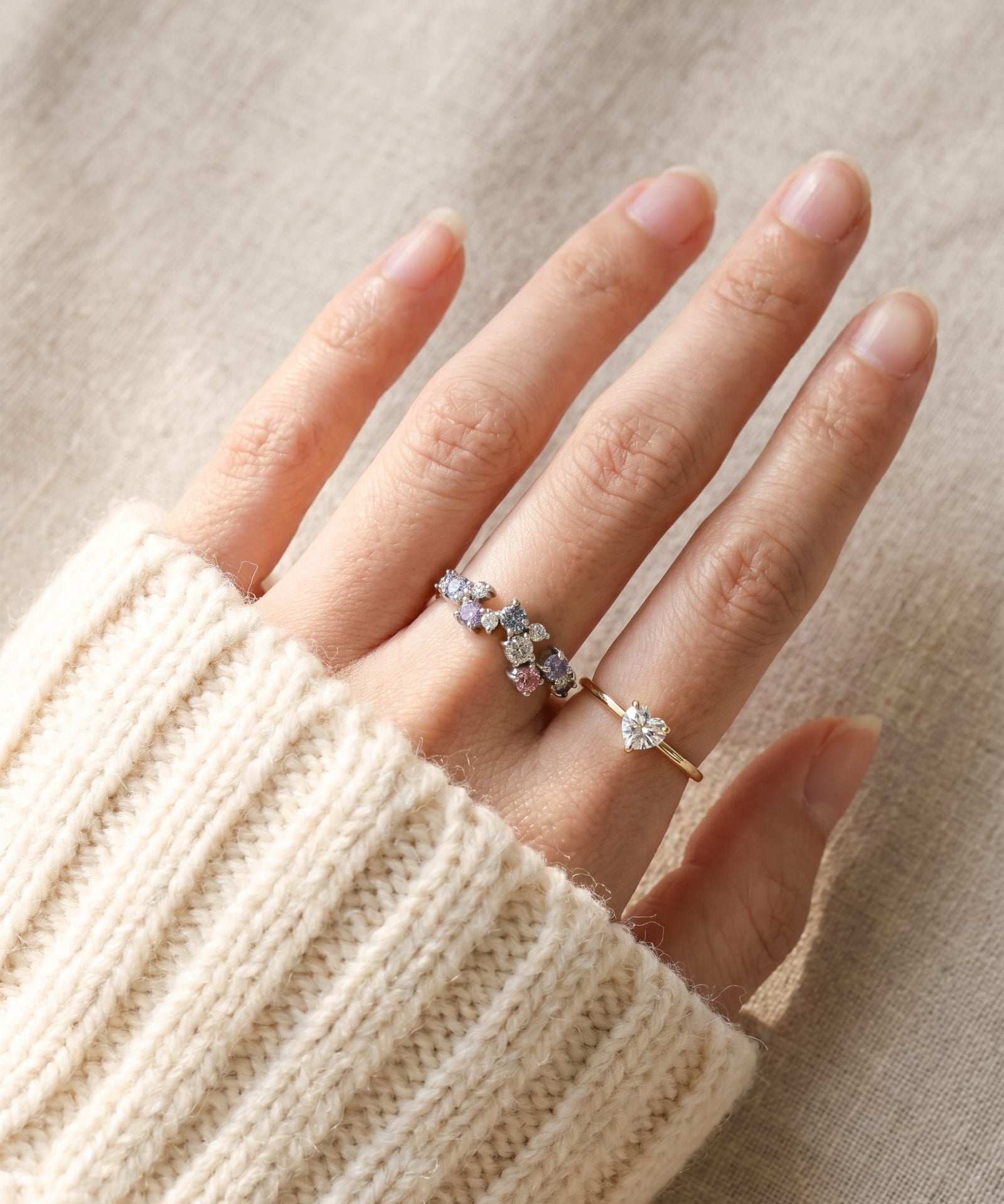 On-hand view of the Painter’s Palette Ring in Yellow Gold, showcasing the soft pastel colors against natural light.