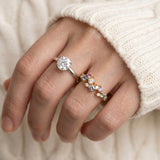 Painter’s Palette Ring in Yellow Gold stacked with a moissanite solitaire, showing a creative and colorful engagement ring style.